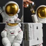 Astronautenfigur mit goldener Helmkappe, detailreiche Nachbildung eines Raumfahrtanzugs, ideal für Dekoration und wissenschaftliche Themen.
