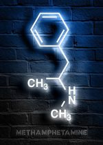 Leuchtendes Neonbild der chemischen Struktur von Methamphetamin an einer Ziegelwand.
