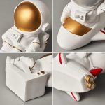 Detaillierte Raumfahrt-Statue mit goldenen Akzenten, ideal für Dekoration und Sammlerstücke. Perfekt für Science-Fiction-Fans und Raumfahrt-Enthusiasten.