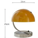 Vintage-Schreibtischlampe mit gelbem Schirm und Metallbasis, ideal für Arbeitszimmer und Schreibtisch.
