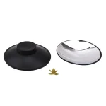 Zwei moderne, runde Schreibtisch-Accessoires in Schwarz und Silber, begleitet von einer kleinen goldfarbenen Figur, ideal für wissenschaftliche Dekorationen und Büroästhetik.
