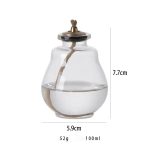 Dekorative Glas-Öllampe mit Docht, ideal für wissenschaftliche Dekorationen und stimmungsvolle Beleuchtung. Maße: 7,7 cm hoch, 5,9 cm breit, 52 g, 100 ml Fassungsvermögen.