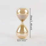 Elegante Sanduhr aus Glas mit einer Höhe von 19 cm und einem Durchmesser von 8 cm, ideal für Dekoration und wissenschaftliche Anwendungen.