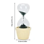 Dekorative Sanduhr mit schwarzem Sand in einem weißen Blumentopf, ideal für wissenschaftliche Dekorationen und als Geschenk.