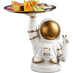 Dekorative Astronautenfigur aus Keramik mit goldfarbenem Helm, die eine Schale mit bunten Süßigkeiten hält, ideal für Science-Fiction- und Weltraumthemen.