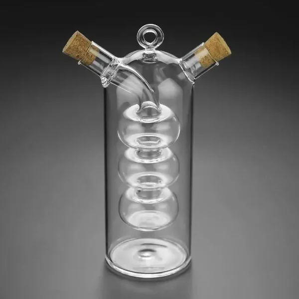 Transparentes wissenschaftliches Glas mit spiralförmiger Innenstruktur und zwei seitlichen Ausgüssen, verschlossen mit Korken, ideal für Experimente.
