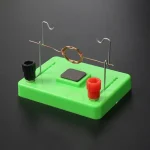 Wissenschaftliches Experimentier-Set mit Elektromagnet, ideal für Bildung und Forschung, auf grünem Basis.
