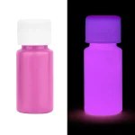 Leuchtendes Fläschchen, das im Dunkeln in Pink leuchtet, ideal für wissenschaftliche Dekorationen und Gadgets.