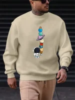 Sweatshirt mit Planeten- und Astronautenillustration, perfekt für Wissenschafts- und Astronomiebegeisterte. Bequem und modisch, ideal für einen lässigen, vom Universum inspirierten Look.