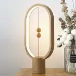 Dekorativer Newton-Wandelobjekt mit schwebenden Kugeln, ideal für Wissenschafts- und Dekorationsliebhaber, modernes Design, beleuchteter Rahmen, elegante Raumdekoration.